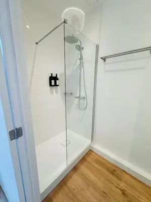 a shower with a glass door in a room at Urbanchic Opéra 2B in Liège