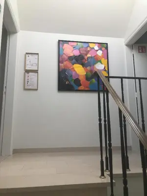 a painting on a wall next to a staircase at Puur17 in Lommel