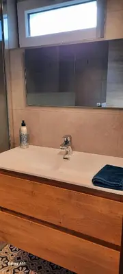 a bathroom with a sink and a mirror at Entre deux Ô à Lixhe,Visé Belgique in Visé