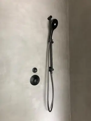 a shower with a shower head on a wall at Huis Vanellus in Hasselt