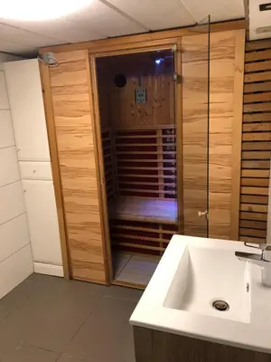 a bathroom with a shower with a white sink at Casa Fratello Bolderberg in Heusden - Zolder