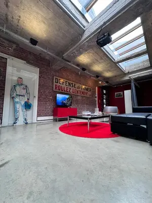a room with a wall with a painting of a man at Sleep You Soon - Loft & parking in Liège