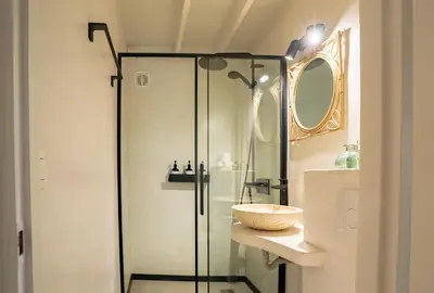 a bathroom with a glass shower and a sink at Boshuisje Rekem - Olive in Lanaken