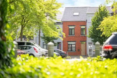 a street with cars parked in front of houses at Chill Hill in Hasselt