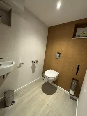 a bathroom with a toilet and a sink at Romagna in Tongeren