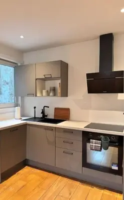 a kitchen with a sink and a stove at Urbanchic Duplex Adalbert 2A in Liège