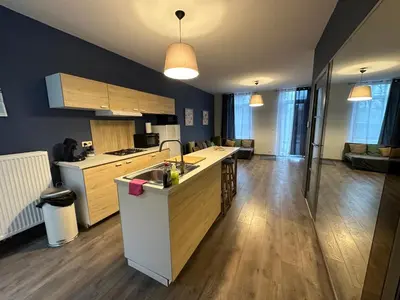 a kitchen with a sink and a counter top at Au 167 Maison de Village in Seraing