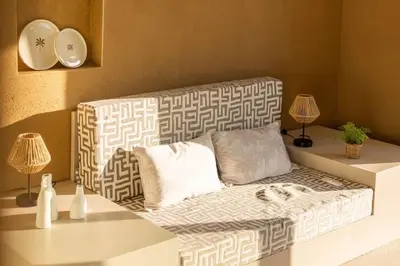 a living room with a couch and two lamps at Gite SIWA pour 2 personnes in Verviers