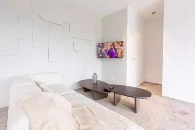 a living room with a couch and a coffee table at Gite Olea de deux personnes in Basse Tribomont