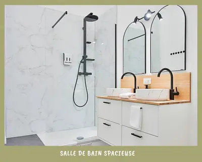 a bathroom with a shower with a sink and a mirror at La bulle bohème - Entièrement neuf, près de Spa in Verviers