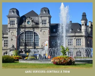 a large building with a fountain in front of it at La bulle bohème - Entièrement neuf, près de Spa in Verviers