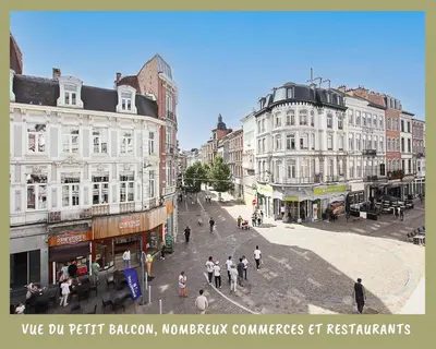 a group of people walking around a street with buildings at La bulle bohème - Entièrement neuf, près de Spa in Verviers
