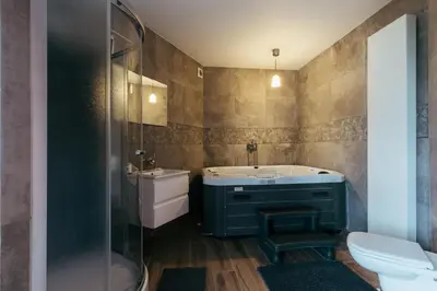 a bathroom with a sink and a toilet at Hotel Riad Nour in Liège