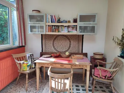 a dining room with a table and two chairs at Chez Marie in Liège