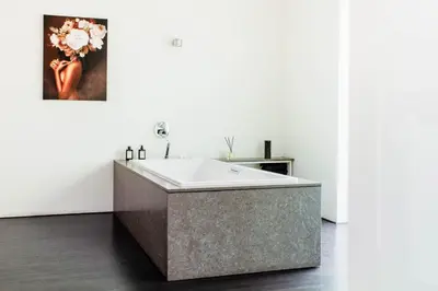 a bathroom with a large bath tub in a room at 8P 4B Lanaken Retreat: Swimming Pool Jacuzzi and Sauna in Lanaken