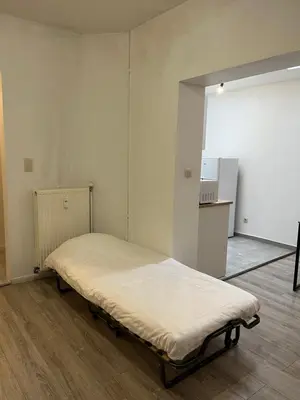 a bedroom with a bed in a room at Superbe studio à Liège in Saint-Léonard
