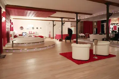 a large room with a bed and a table at Studio Le Baiser d'Angeli in Ensival