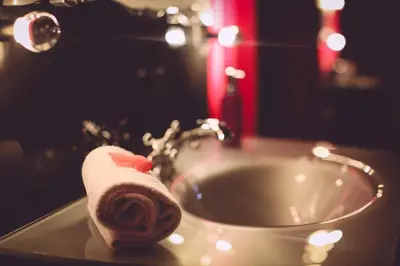 a roll of toilet paper sitting on top of a sink at Studio Le Baiser d'Angeli in Ensival