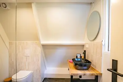 a bathroom with a sink and a toilet at Boshuisje Rekem - Ignis in Lanaken