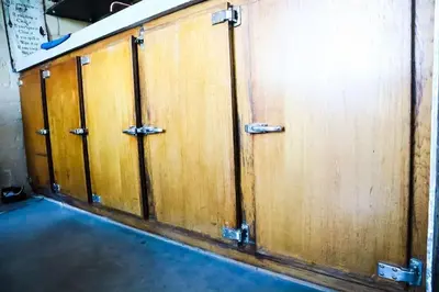 a group of wooden doors in a room at Waterside Zen - Maastricht in Visé