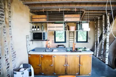 a small kitchen with a sink and a counter at Waterside Zen - Maastricht in Visé