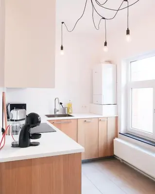 a kitchen with a sink and a counter top at 1 bedroom apartment in Liège center - 1st floor in Liège