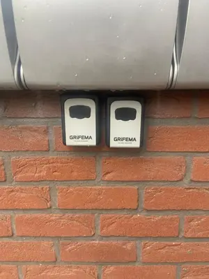 two electrical outlets on a brick wall at Le cozy escape in Herstal