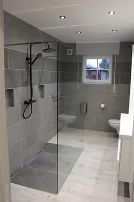 a bathroom with a shower with a glass door at Eaglenest in Baelen