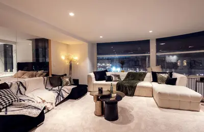 a living room with white furniture and a large window at Dream Saint Lambert in Liège