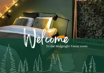 a welcome to the midnight forest room sign with a bed at Chambre et salle de bain privative in Liège