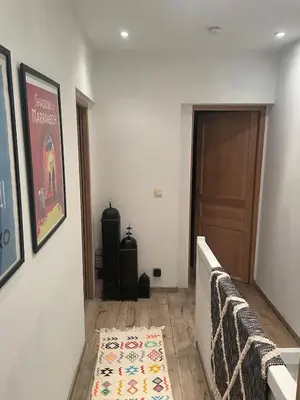 a hallway with a door and a rug on the floor at Quiet villa Exceptional view and its exterior in Liège