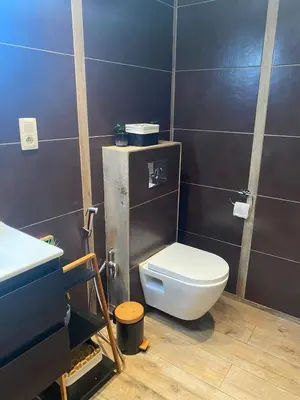 a bathroom with a toilet and a sink at Quiet villa Exceptional view and its exterior in Liège