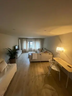a living room with a couch and a table at Ô Gadot in Chaudfontaine