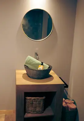 a bathroom with a sink and a mirror at Sfeervolle B&B in de Voerstreek Lo-Ghis - met Zwembad in Voeren
