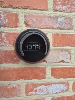 a black object is on a brick wall at Princenhuis37 in Tongeren