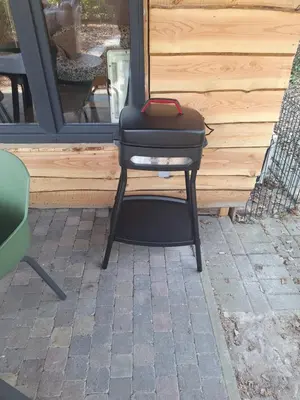 a black stool with a bag on top of it at Sakurahuisje in Lanaken