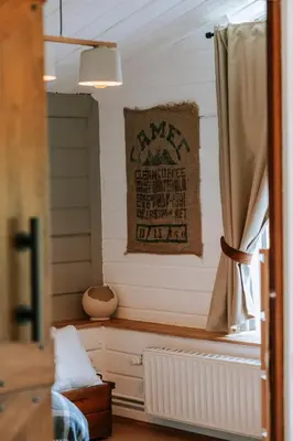 a room with a window with a radiator and a curtain at Le chalet Sud in Verviers
