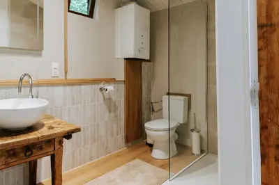 a bathroom with a sink and a toilet at Le chalet Sud in Verviers