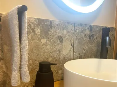 a bathroom with a white toilet and a sink at Zutendaal Forest Retreat in Zutendaal