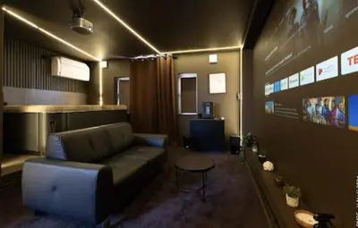 a living room with a couch and a table at Spa&Chill in Seraing