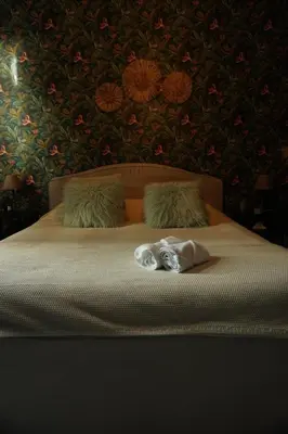 a bedroom with a bed with two towels on it at ChambreNchill in Seraing