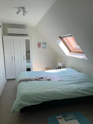 a bedroom with a bed with a skylight at GT Lounge Zolder in Heusden - Zolder