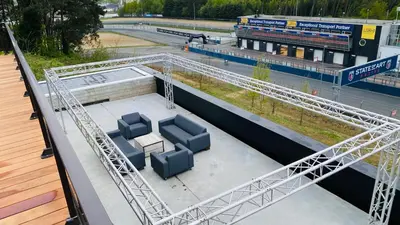 an overhead view of a bridge with two blue chairs at GT Lounge Zolder in Heusden - Zolder