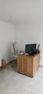 an office with a desk with a computer on it at Comme chez Soi in Liège