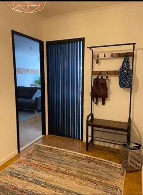a living room with a door open to a patio at Hasselita in Hasselt