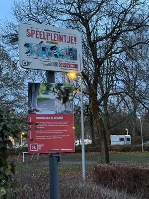 a sign in a park with a dog on it at Hasselita in Hasselt