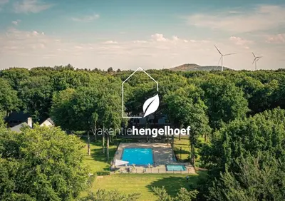 an aerial view of a swimming pool and windmills at Acacia 8 Hengelhoef in Houthalen-Helchteren