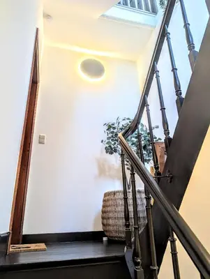 a staircase leading up to a house with a window at 't Herenhoes in Pelt