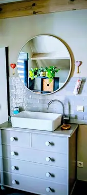a bathroom with a sink and a mirror at 't Herenhoes in Pelt