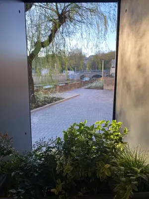 a window with a view of a brick road at Weserwasser in Eupen